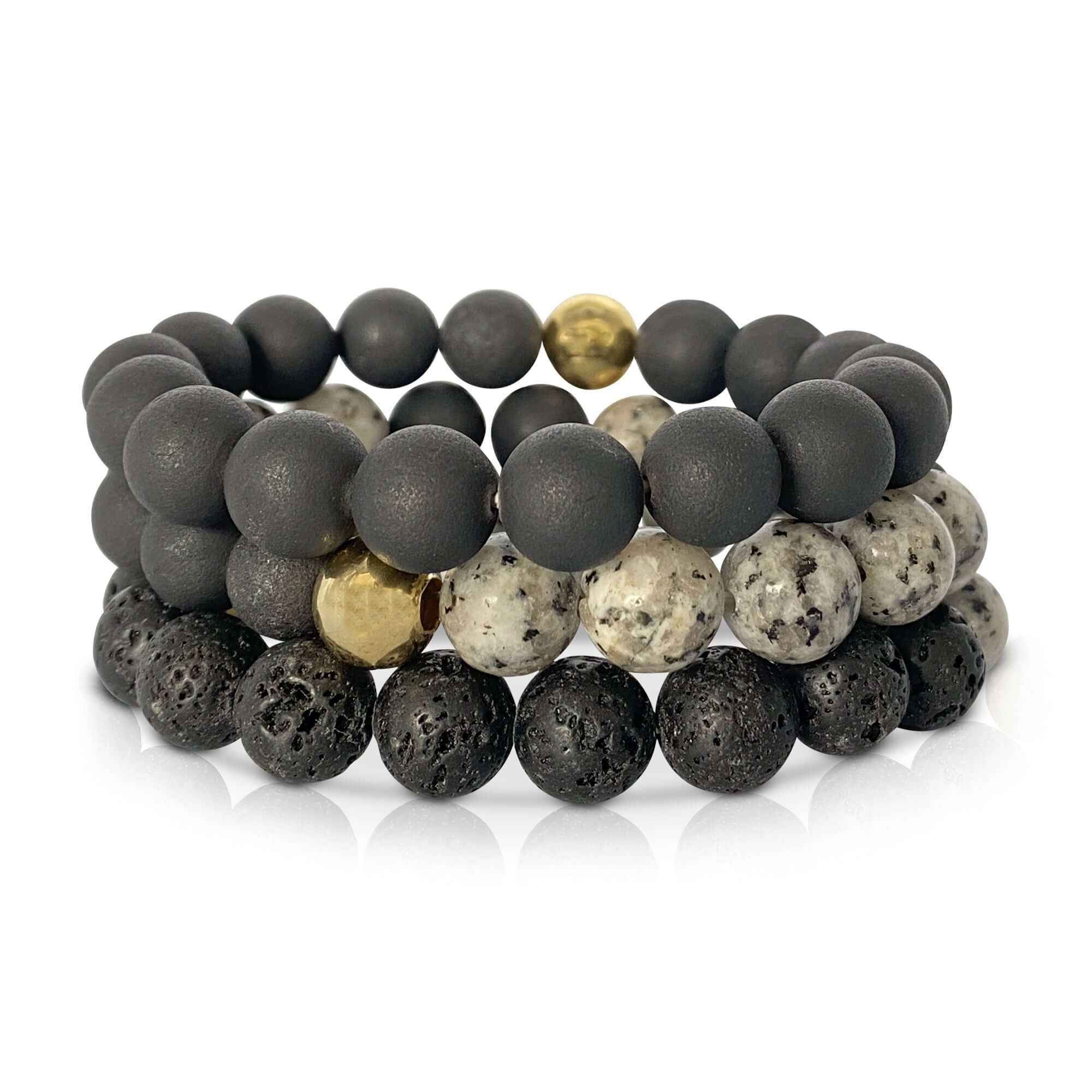 A set of 3 black beaded stacking bracelets against a white background.
