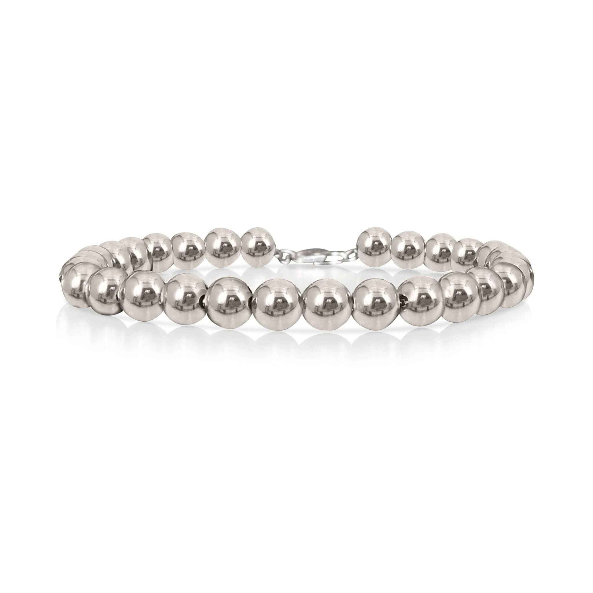 A silver beaded bracelet against a white background.