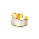 Elegant 18k yellow gold plated enamel band ring in white by Alessandra James, reflecting vintage elegance.