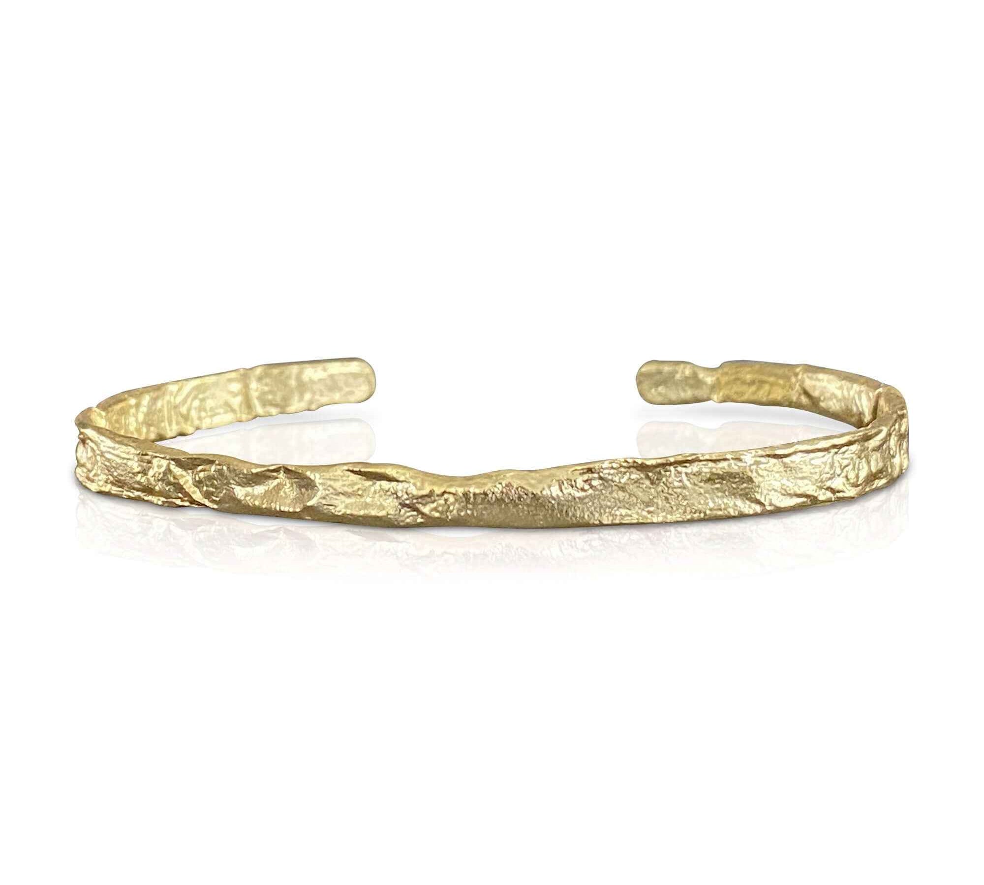 Elegant 18k gold-plated foil textured bangle bracelet by Alessandra James, reflecting quiet luxury trend.