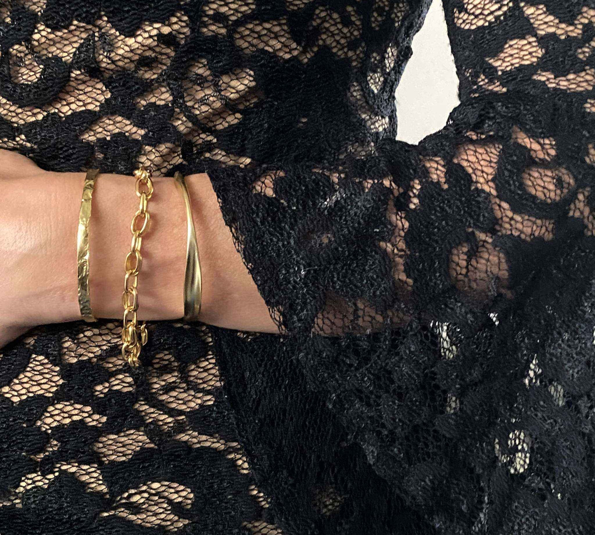 Gold Foil Textured Bangle styled with other luxury jewelry pieces, highlighting its versatility.