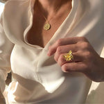 Gold Star Pendant Necklace styled in a layered look - from Alessandra James.