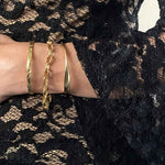 Alessandra James Gold Wave Bangle styled on a model, epitomizing the quiet luxury trend.