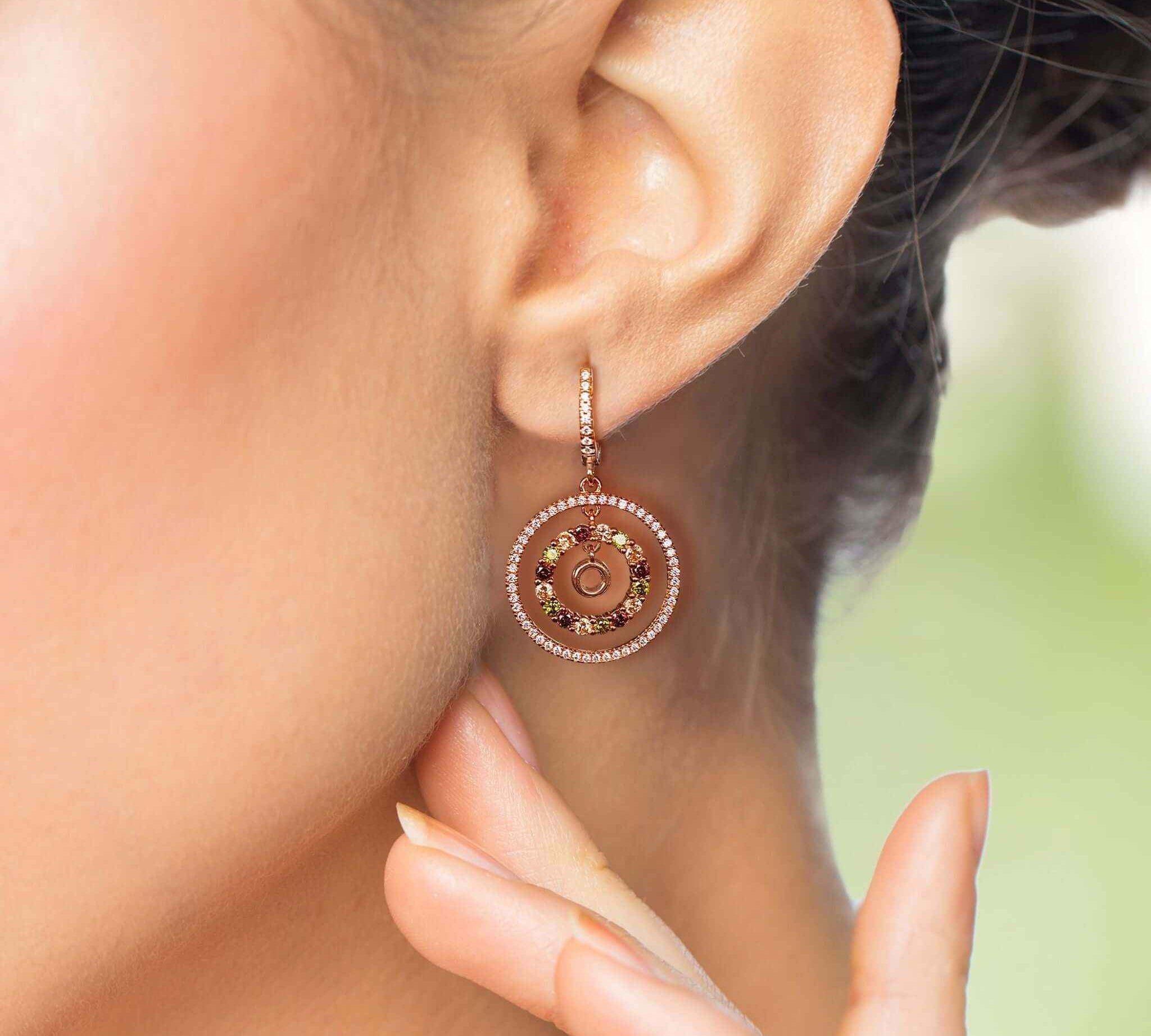 Close-up view of Halo Drop Earrings showcasing the intricate cubic zirconia detailing and rose gold finish.