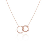 Elegant Interlocking Rings Necklace in a quiet luxury style by Alessandra James.