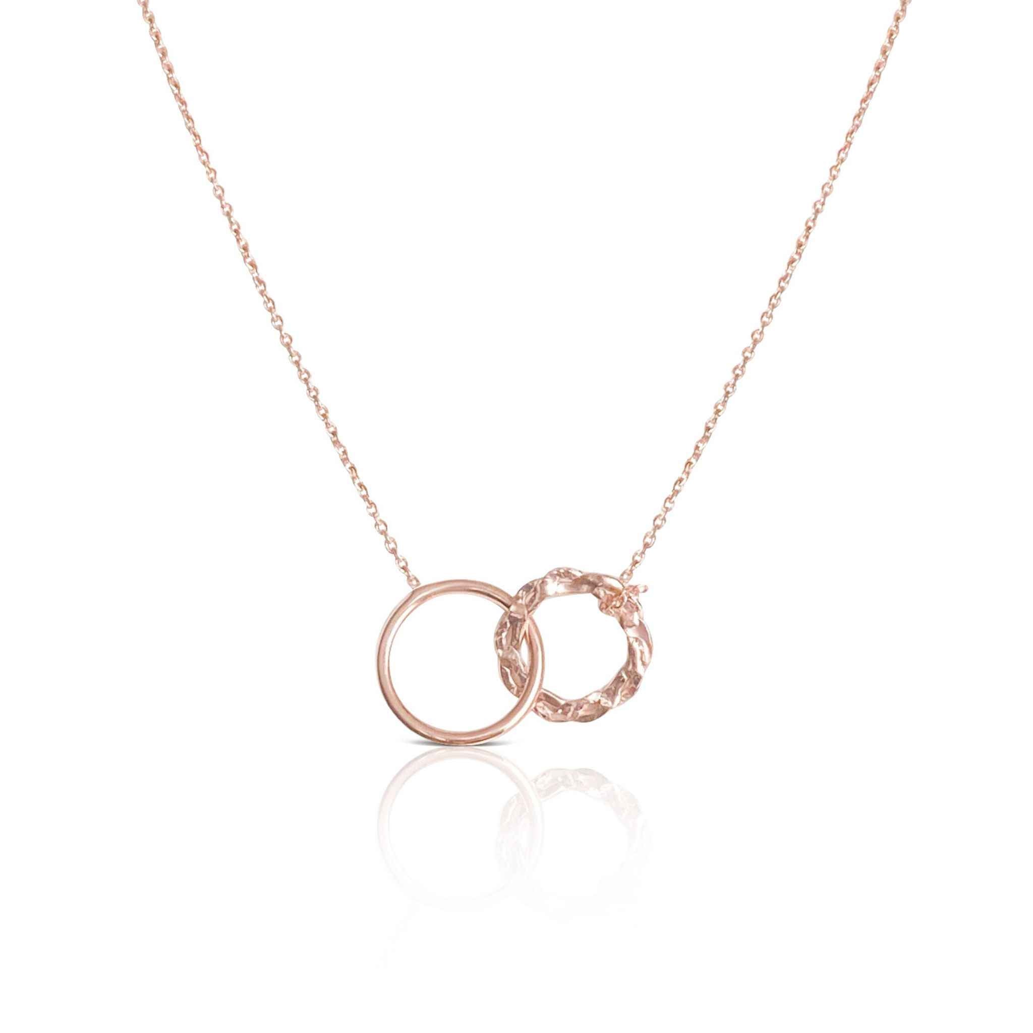 Elegant Interlocking Rings Necklace in a quiet luxury style by Alessandra James.