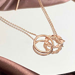 Close-up view of the Interlocking Rings Necklace showcasing its simple yet intricate design.
