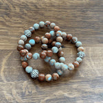 Close-up of Jasper Bracelets with Turquoise - symbolizing protection and wisdom.