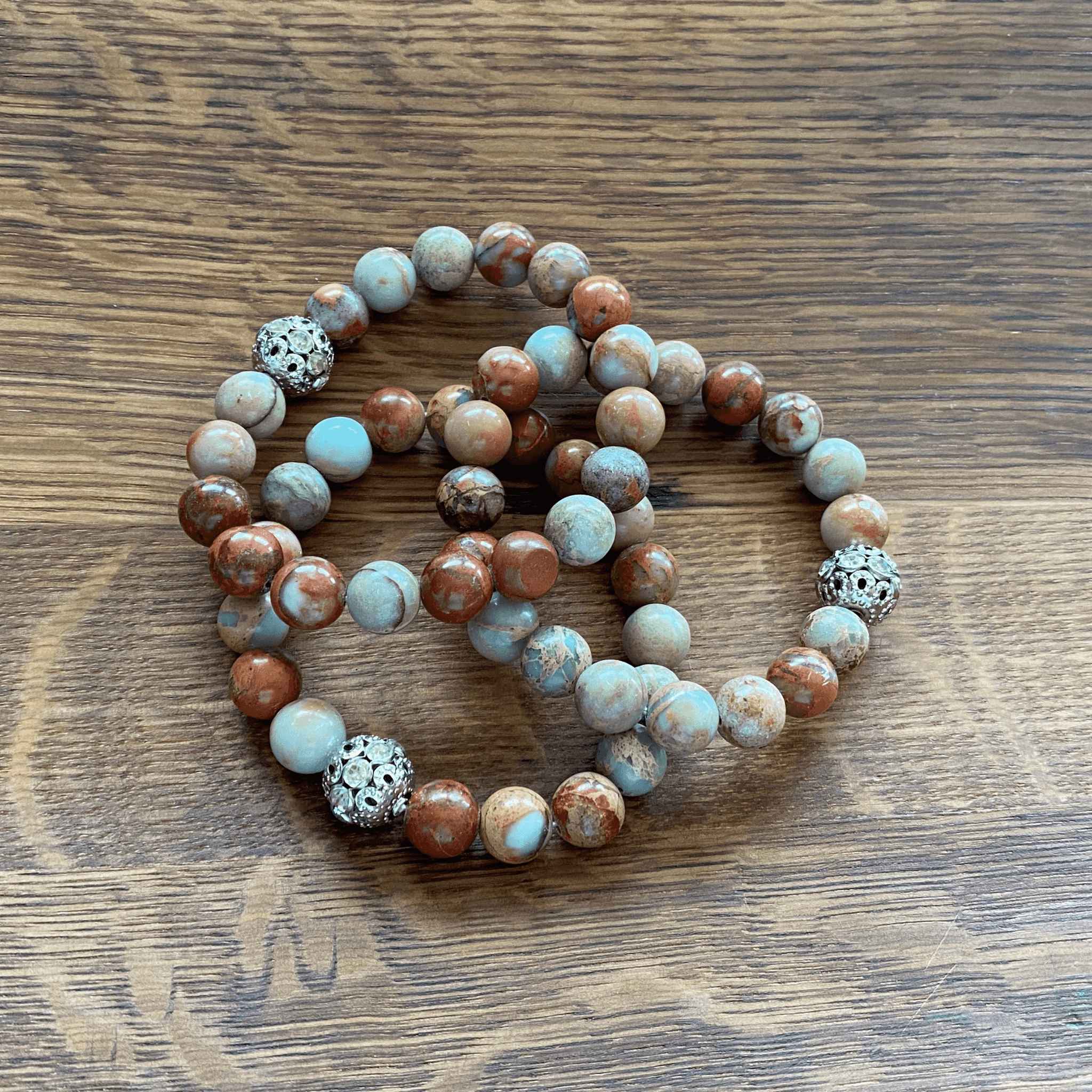 Close-up of Jasper Bracelets with Turquoise - symbolizing protection and wisdom.