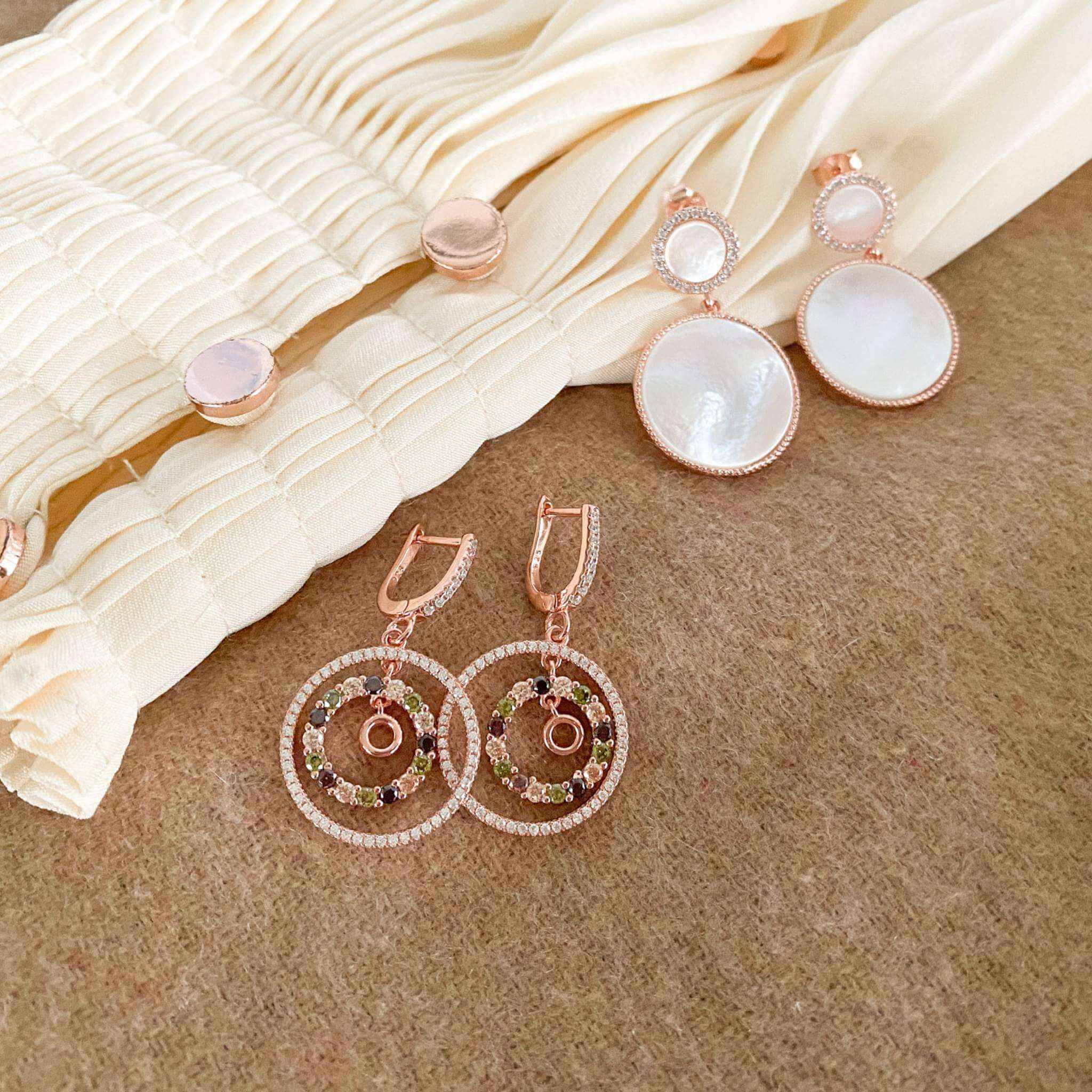 Styled perspective of mother of pearl teardrop earrings with a refined rose gold finish, showcasing exquisite craftsmanship.