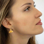 Close-up view of Handcrafted Orchid Drop Earrings in Gold by Alessandra James.