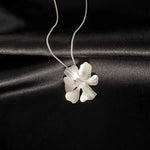 Silver Peony Pendant Necklace from Alessandra James, Timeless and Chic Jewelry Piece, Ideal for Any Outfit.