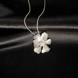 Silver Peony Pendant Necklace from Alessandra James, Timeless and Chic Jewelry Piece, Ideal for Any Outfit.