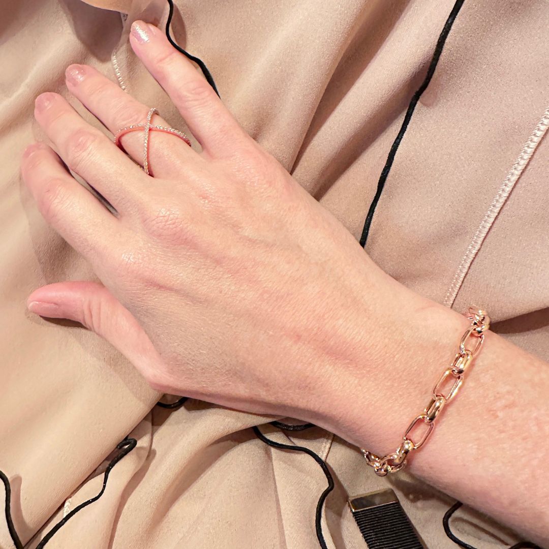 Closeup of Rectangular Chain Link Bracelet worn elegantly on a woman's wrist.