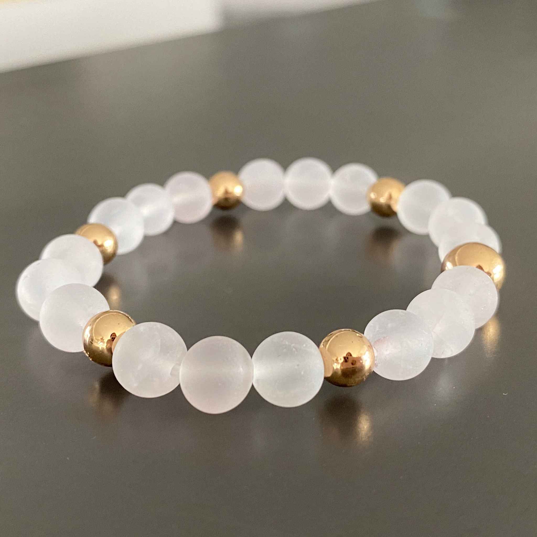 Beautifully displayed Rose Quartz Bracelet for women, symbolizing love and peace, by Alessandra James.