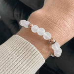 Close-up view of Rose Quartz Bracelet with gold detailing, perfect for tranquility and gentle energy.