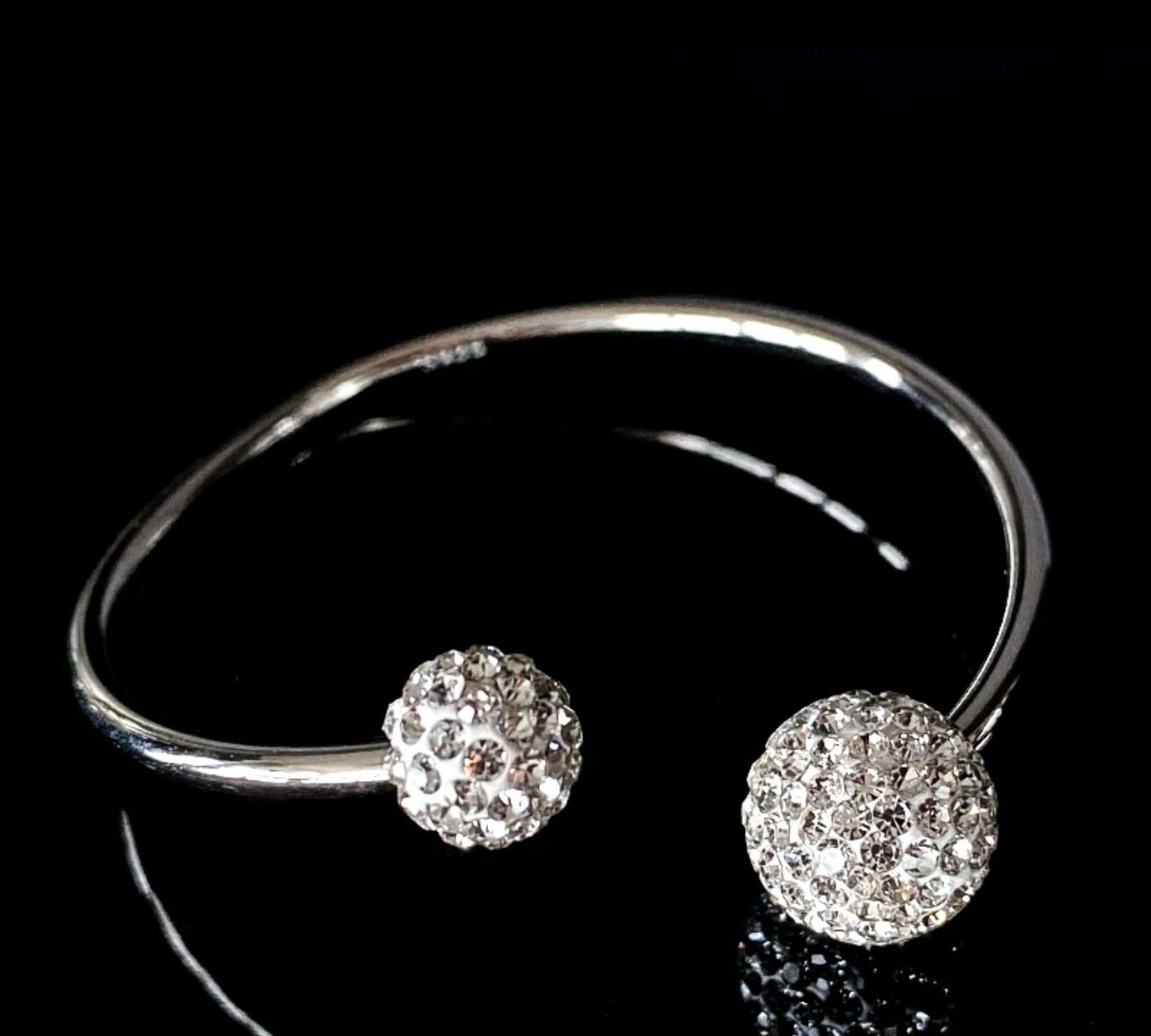 Detailed view of high-quality cubic zirconia on silver Shambala Ball Arm Bangle by Alessandra James.