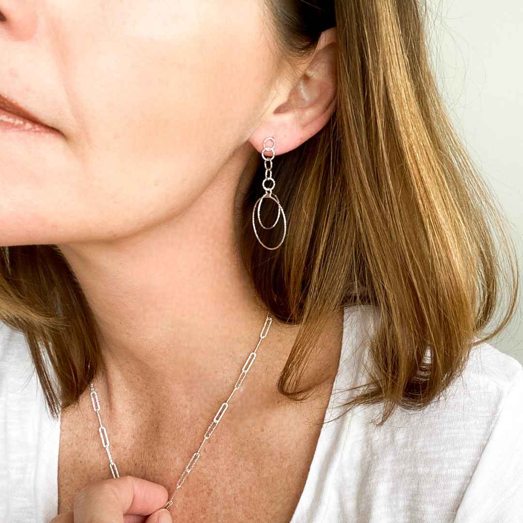 Close-up view of Shimmering Chain Drop Earrings in Silver, a delicate drop earring by Alessandra James.