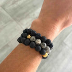 Fashionable shield for the day: Black Lava Stone and Druzy Agate Bracelets worn on wrist.