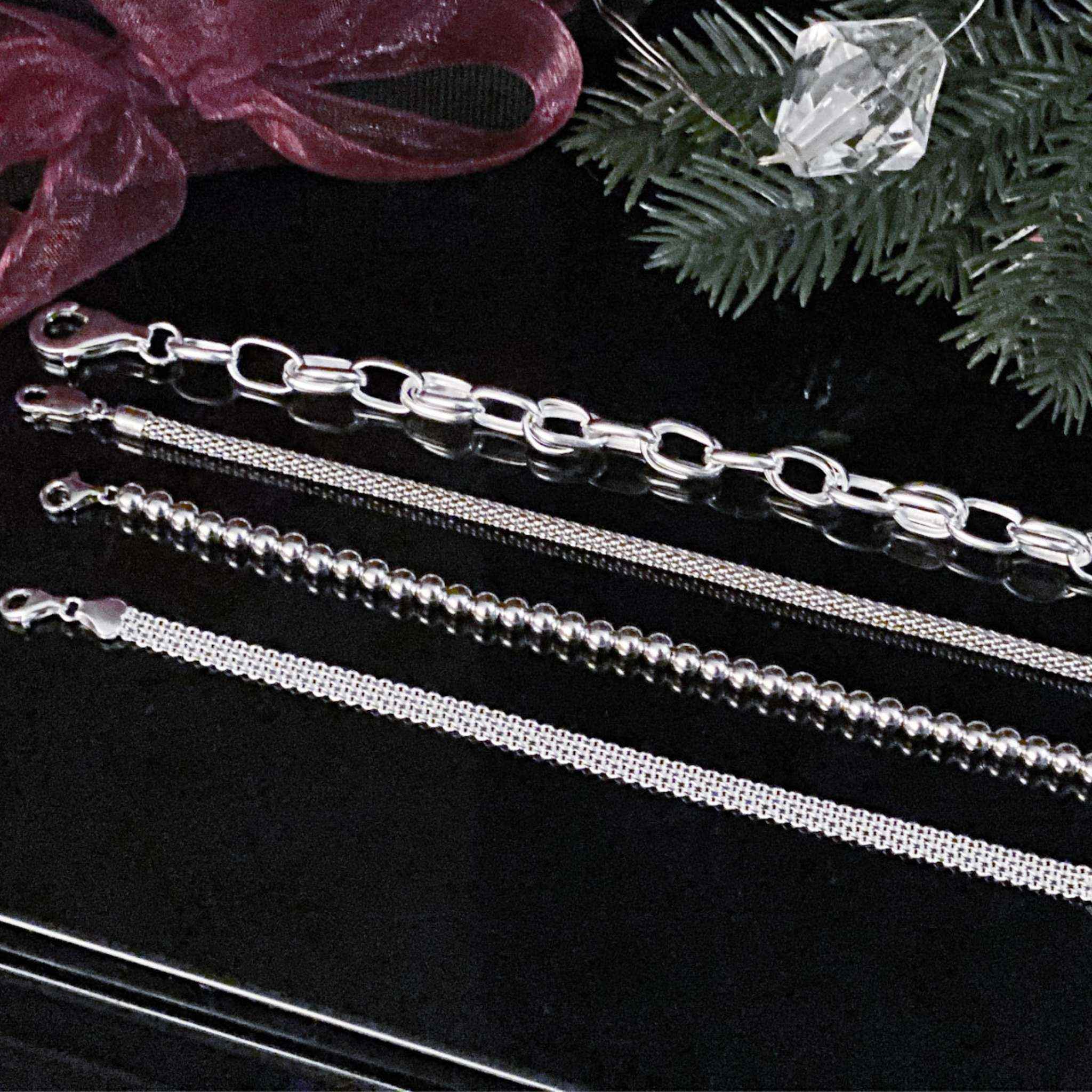 Close-up view of sterling silver rope bracelet detailing.