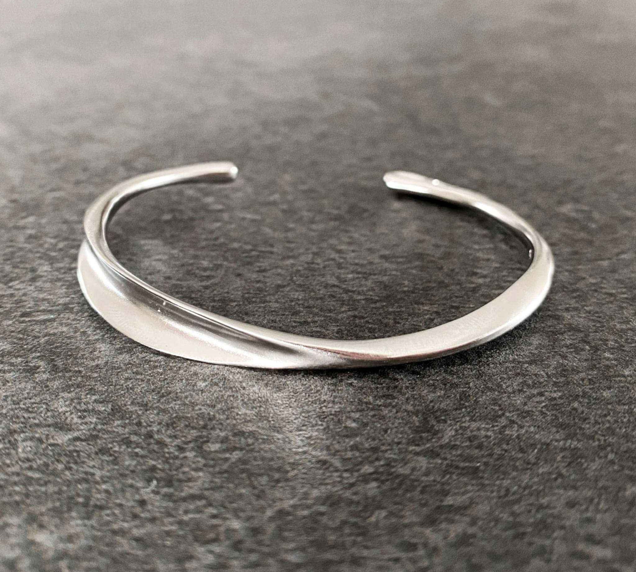 Close-up of Sterling Silver Wave Bracelet - Chic Accessory for Women by Alessandra James.