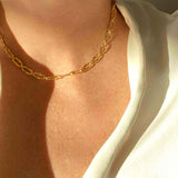 Close-up view of the T-Bar Link design in gold, a modern jewelry piece by Alessandra James.