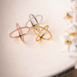 Side perspective of 18k gold plated cross rings showcasing its refined elegance by Alessandra James.
