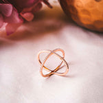 Side angle of the Waverly Cross Ring in Rose Gold highlighting its unique crisscross design.